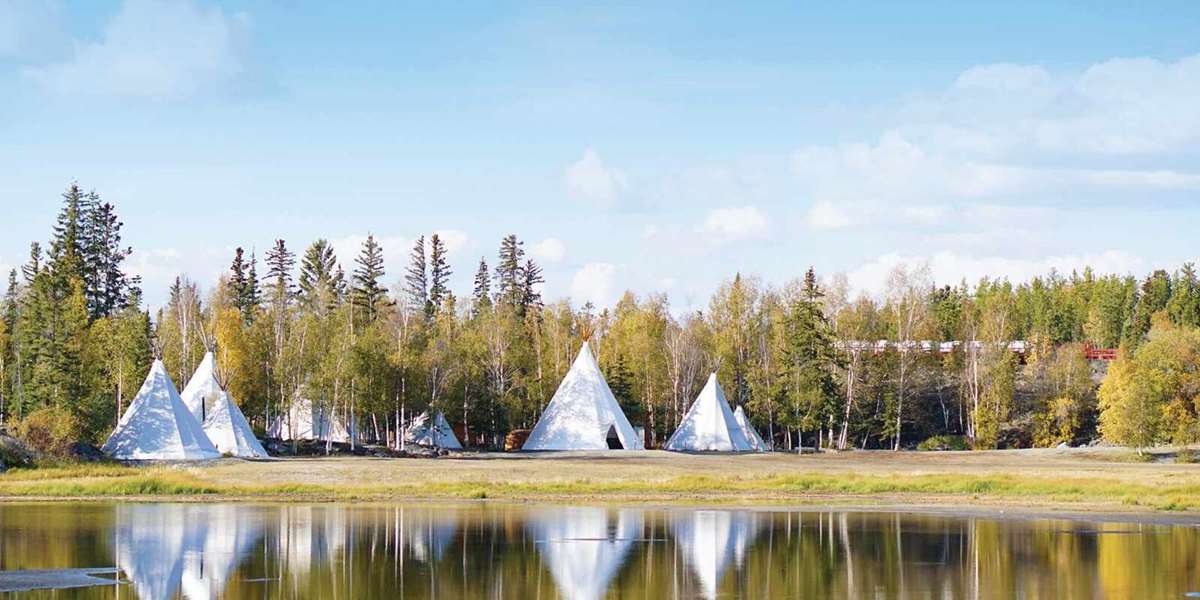 Nortwest Territories Canada with tepees pitched by lake